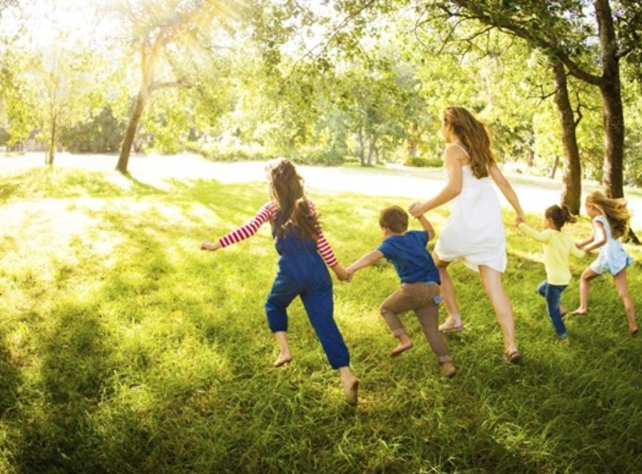 Family running in Meadow